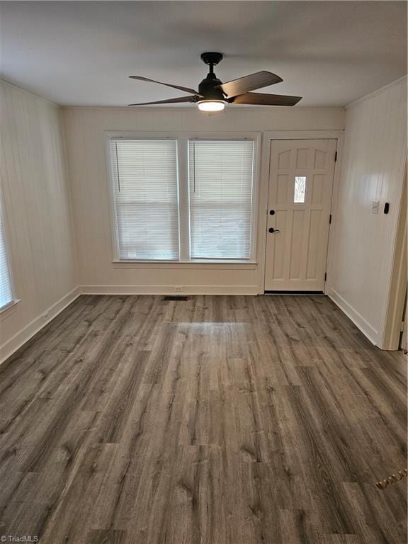 entrance foyer featuring ceiling fan, baseboards, and wood finished floors