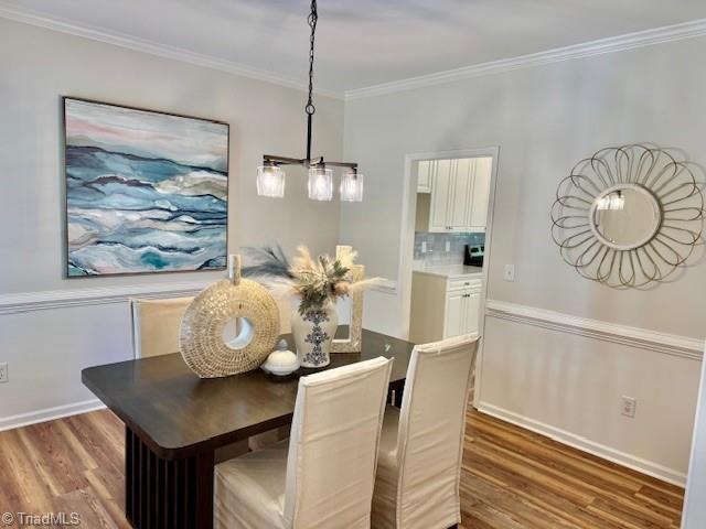121 Spring Lake Ct, Lexington, NC 27295 - dining space with wood finished floors and ornamental molding