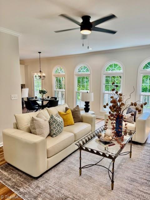 121 Spring Lake Ct, Lexington, NC 27295 - living area with crown molding, ceiling fan, a chandelier, and wood finished floors