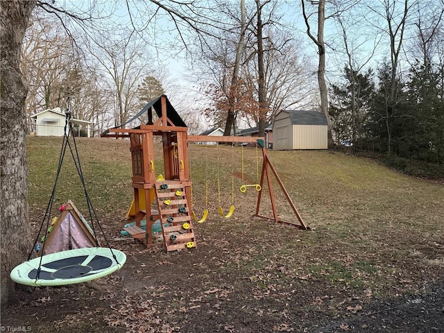 view of play area featuring a lawn and a shed