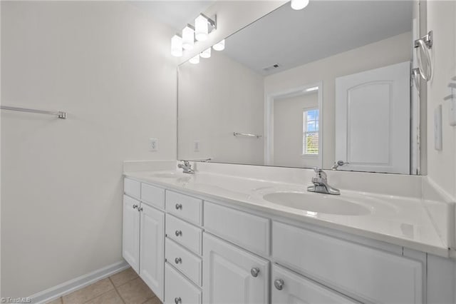full bath with visible vents, a sink, tile patterned flooring, and double vanity