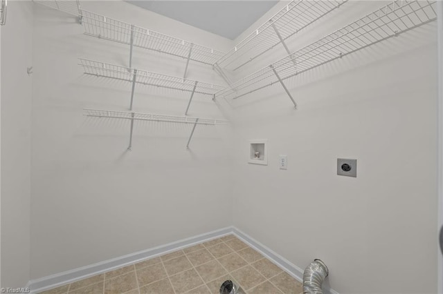 laundry area with washer hookup, electric dryer hookup, baseboards, and laundry area