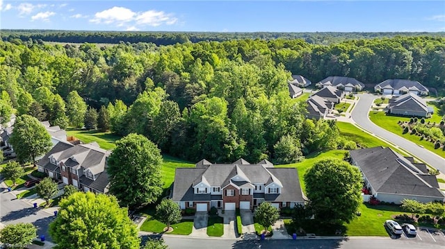 aerial view featuring a view of trees and a residential view