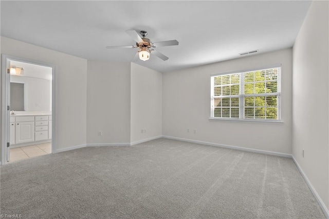 604 Oakfield Trl, Mebane, NC 27302 - spare room with a ceiling fan, baseboards, visible vents, and light carpet