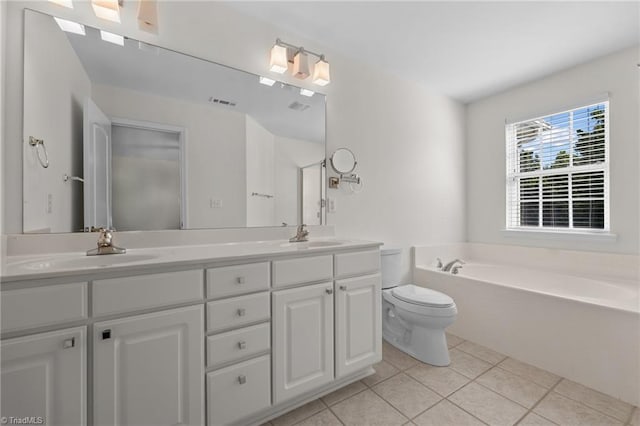 full bathroom featuring a sink, tile patterned flooring, a garden tub, and double vanity