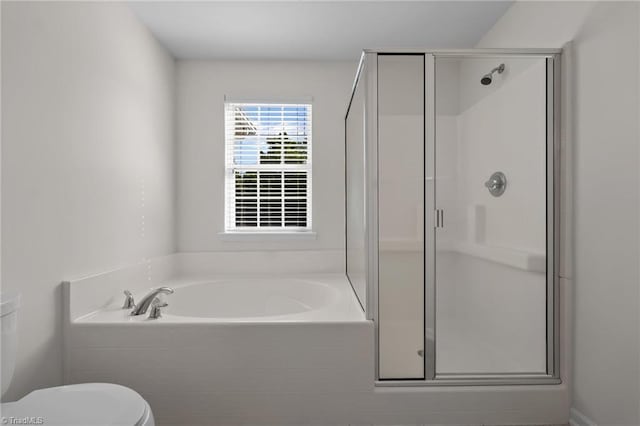 bathroom with a bath, toilet, and a shower stall