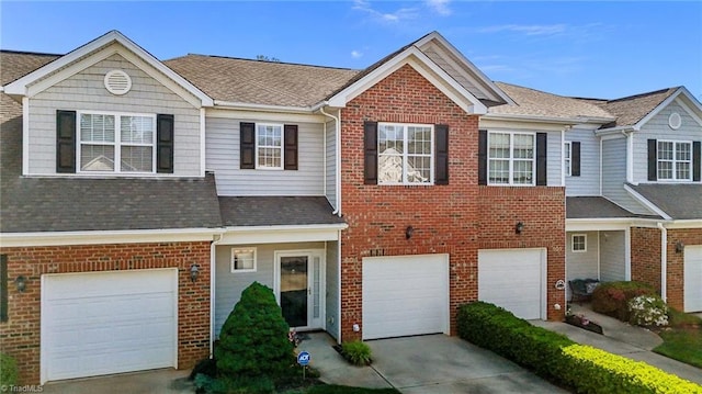 604 Oakfield Trl, Mebane, NC 27302 - view of property featuring brick siding, a garage, roof with shingles, and driveway