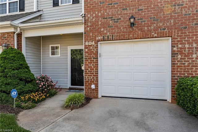 garage featuring driveway
