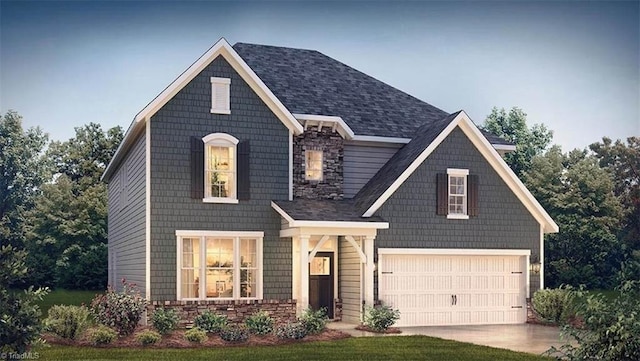 craftsman-style home featuring a front lawn and a garage