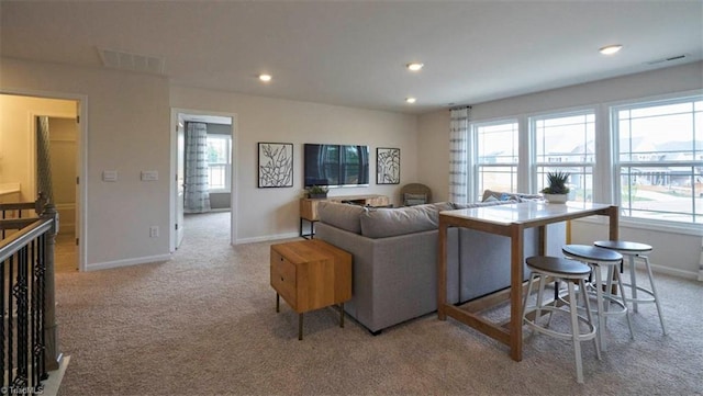 living room with light colored carpet