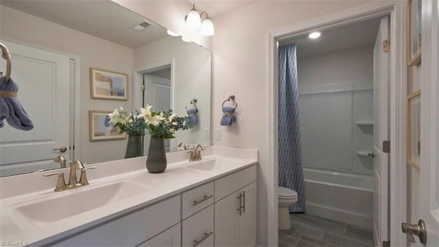 full bathroom featuring shower / bathtub combination with curtain, vanity, and toilet