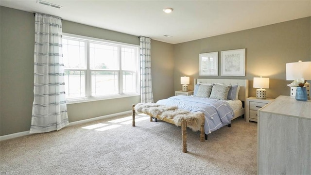 bedroom with light carpet