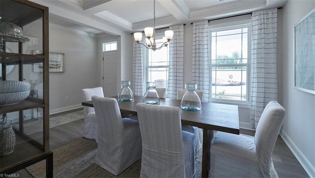 dining room with a chandelier, beam ceiling, ornamental molding, and dark wood-type flooring