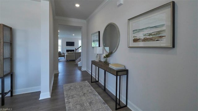 corridor featuring dark hardwood / wood-style flooring and ornamental molding