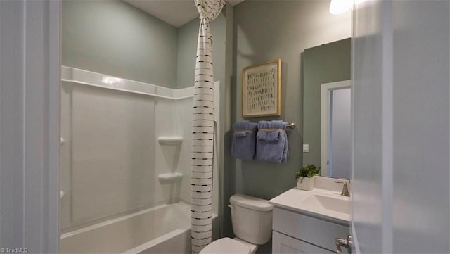 full bathroom featuring shower / bath combo, toilet, and vanity