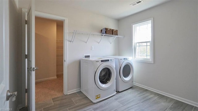 laundry room featuring independent washer and dryer