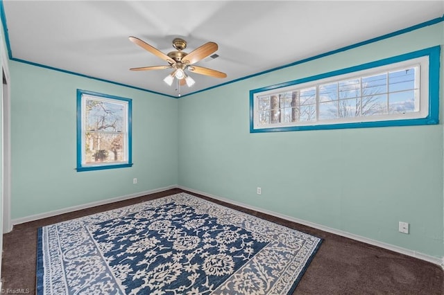 spare room featuring ceiling fan and ornamental molding