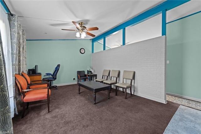 carpeted office space with vaulted ceiling and ceiling fan