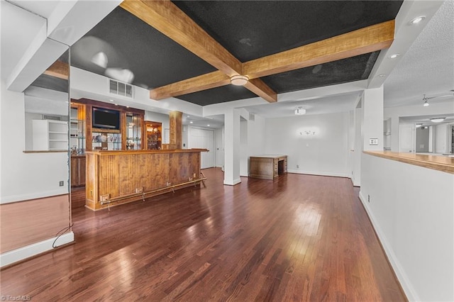 bar featuring beam ceiling, dark hardwood / wood-style floors, and built in shelves