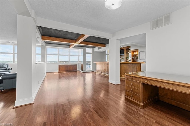 interior space featuring coffered ceiling, a textured ceiling, hardwood / wood-style floors, and beam ceiling