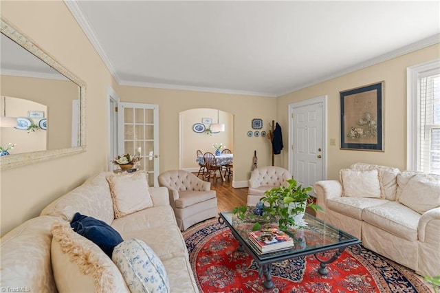 living room with hardwood / wood-style floors and ornamental molding