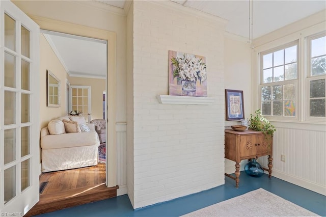 corridor with ornamental molding and french doors