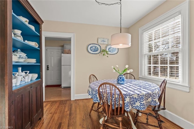 dining area featuring hardwood / wood-style floors