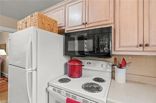 kitchen featuring white appliances, backsplash, and light brown cabinetry