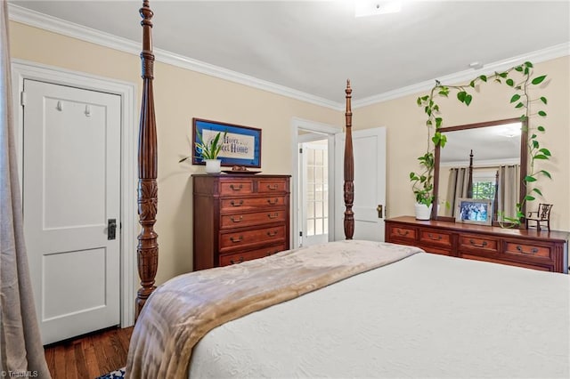 bedroom featuring dark hardwood / wood-style flooring and ornamental molding