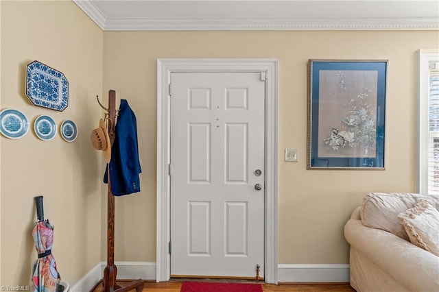 entryway featuring crown molding