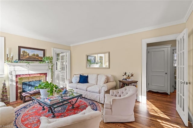 living room with hardwood / wood-style floors and ornamental molding