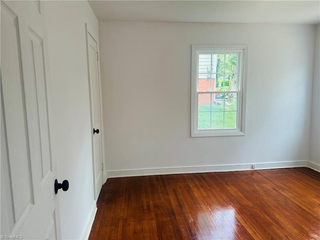 524 Ashburn St, High Point, NC 27260 - spare room with wood-type flooring and baseboards