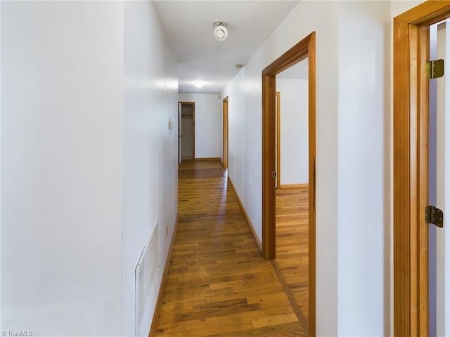 hall with light hardwood / wood-style flooring