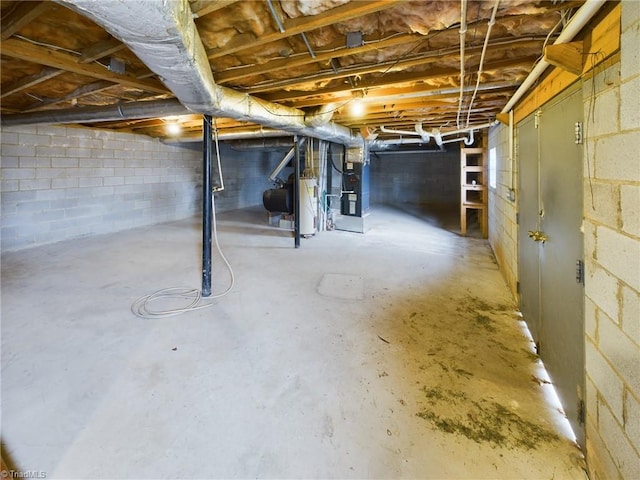 basement with water heater and heating utilities