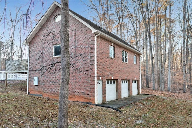 view of side of property featuring a garage