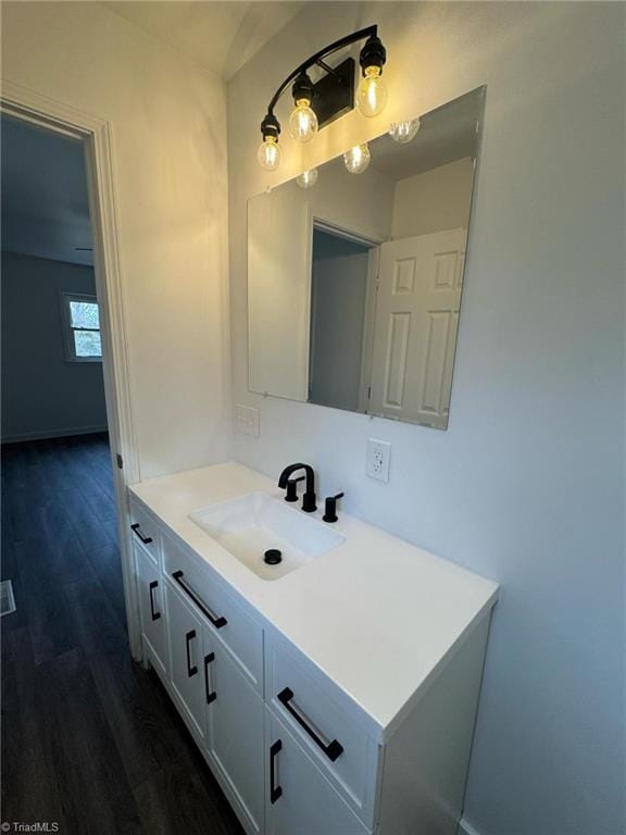 bathroom featuring wood finished floors and vanity