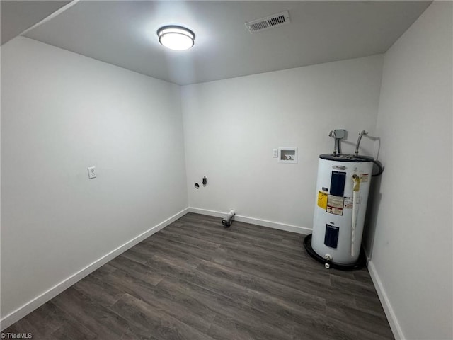 washroom with electric water heater, laundry area, dark wood-type flooring, washer hookup, and visible vents