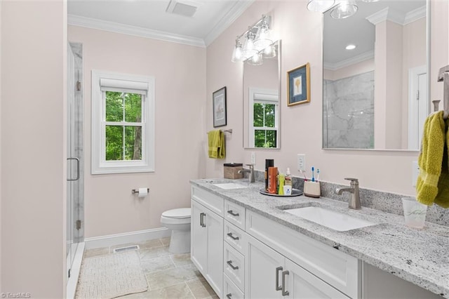 bathroom featuring baseboards, a shower stall, double vanity, toilet, and ornamental molding