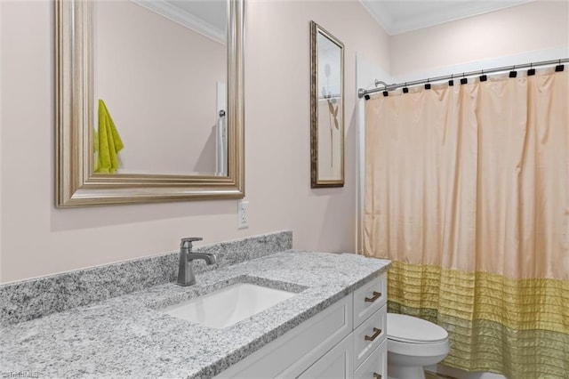 bathroom featuring ornamental molding, toilet, vanity, and curtained shower