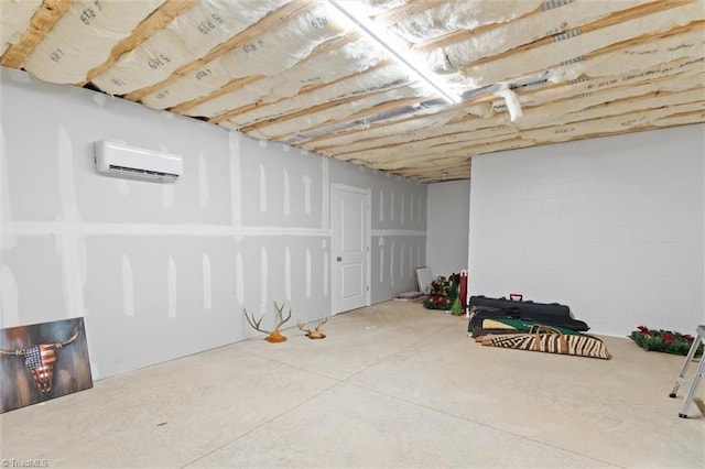 unfinished basement featuring a wall mounted air conditioner