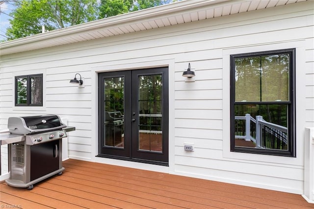 deck with a grill and french doors