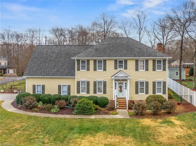 colonial home with a front yard