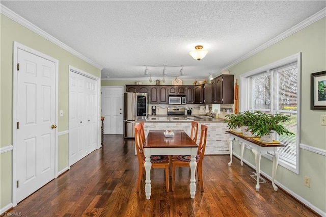 kitchen with dark brown cabinets, dark hardwood / wood-style flooring, stainless steel appliances, and ornamental molding