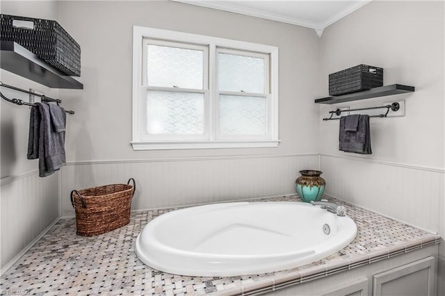 bathroom with a tub to relax in and crown molding