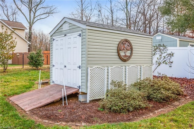 view of outbuilding featuring a yard