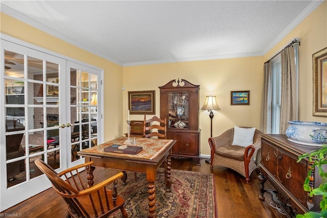 sitting room featuring french doors, dark hardwood / wood-style floors, and ornamental molding