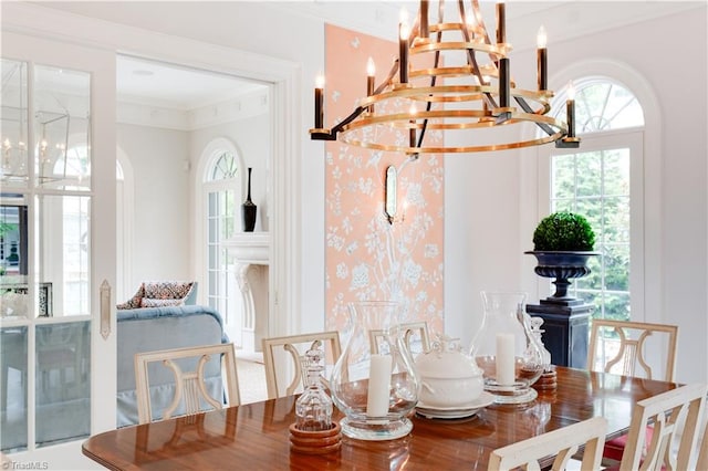 dining room featuring ornamental molding and a chandelier