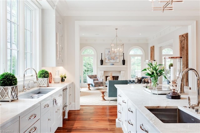 kitchen featuring white cabinetry, sink, and plenty of natural light