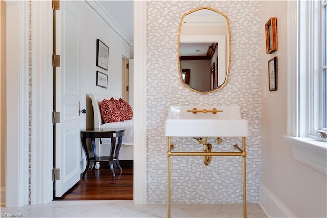 bathroom featuring crown molding and hardwood / wood-style flooring