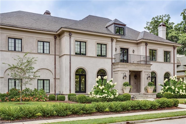 view of front of home with a balcony